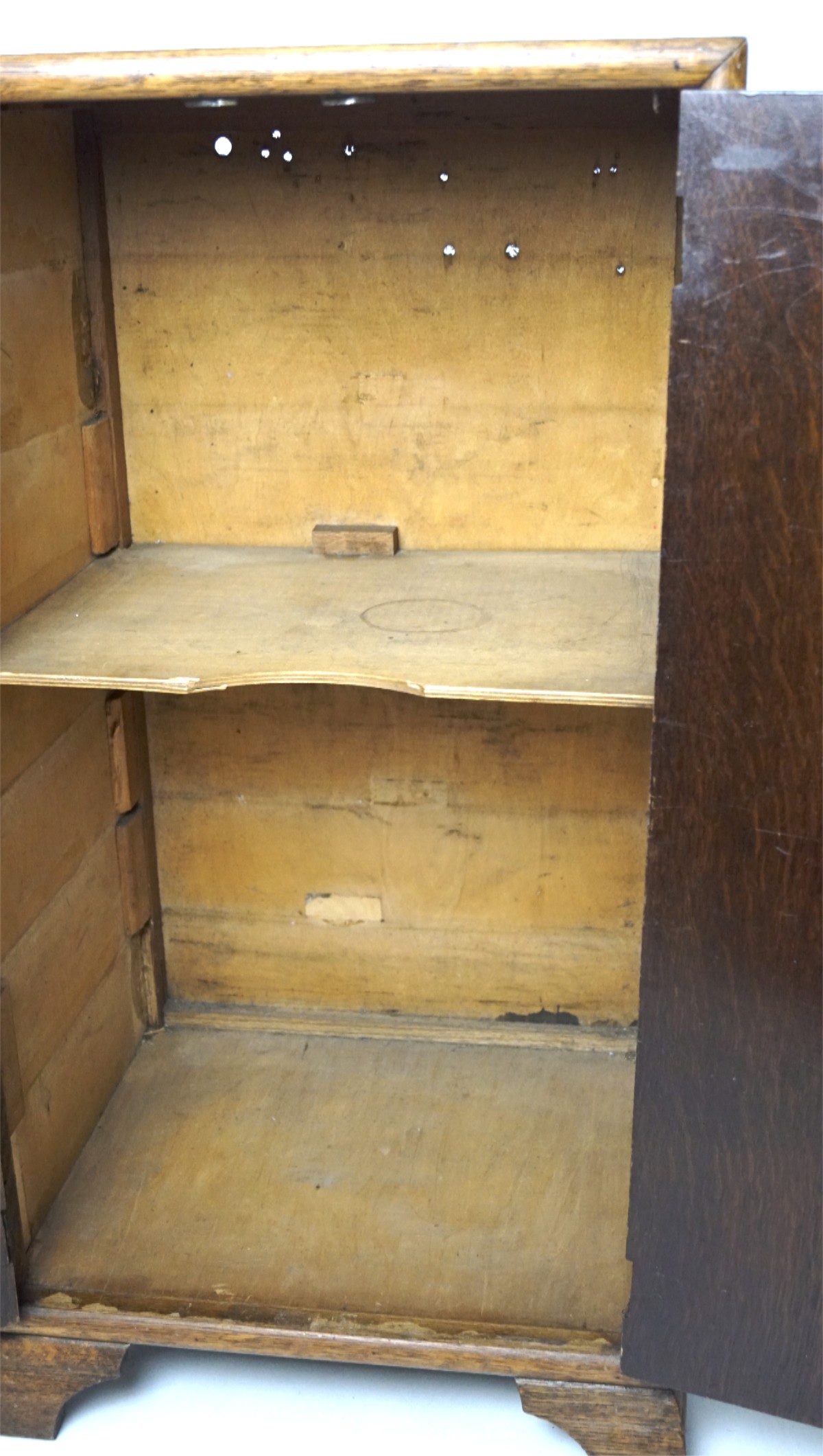 A 20th century oak two door cabinet, containing a single shelf, on bracket supports, L42cm x D35. - Image 2 of 2