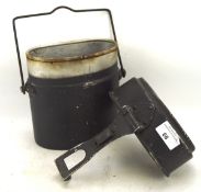 A brass mounted horn powder flask and a World War II period metal food container with adjustable