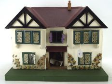 A vintage doll's house, mid-century, including some fittings and contents,