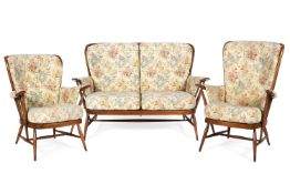 An Ercol spindle back upholstered three piece suite design 9142, 18/12/89,