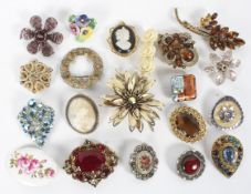 A collection of vintage brooches, including two cameos,