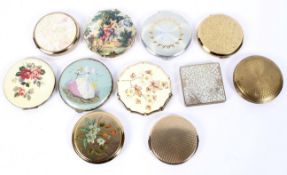 Eleven vintage compacts, including Statton and other examples decorated with flowers and figures,