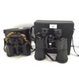 Two pairs of binoculars, a Super Zenith 20x50 and USSR 8x30 field glasses,