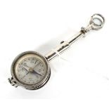 A vintage chrome French travelling compass with magnifiers