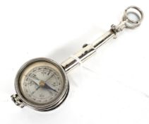 A vintage chrome French travelling compass with magnifiers