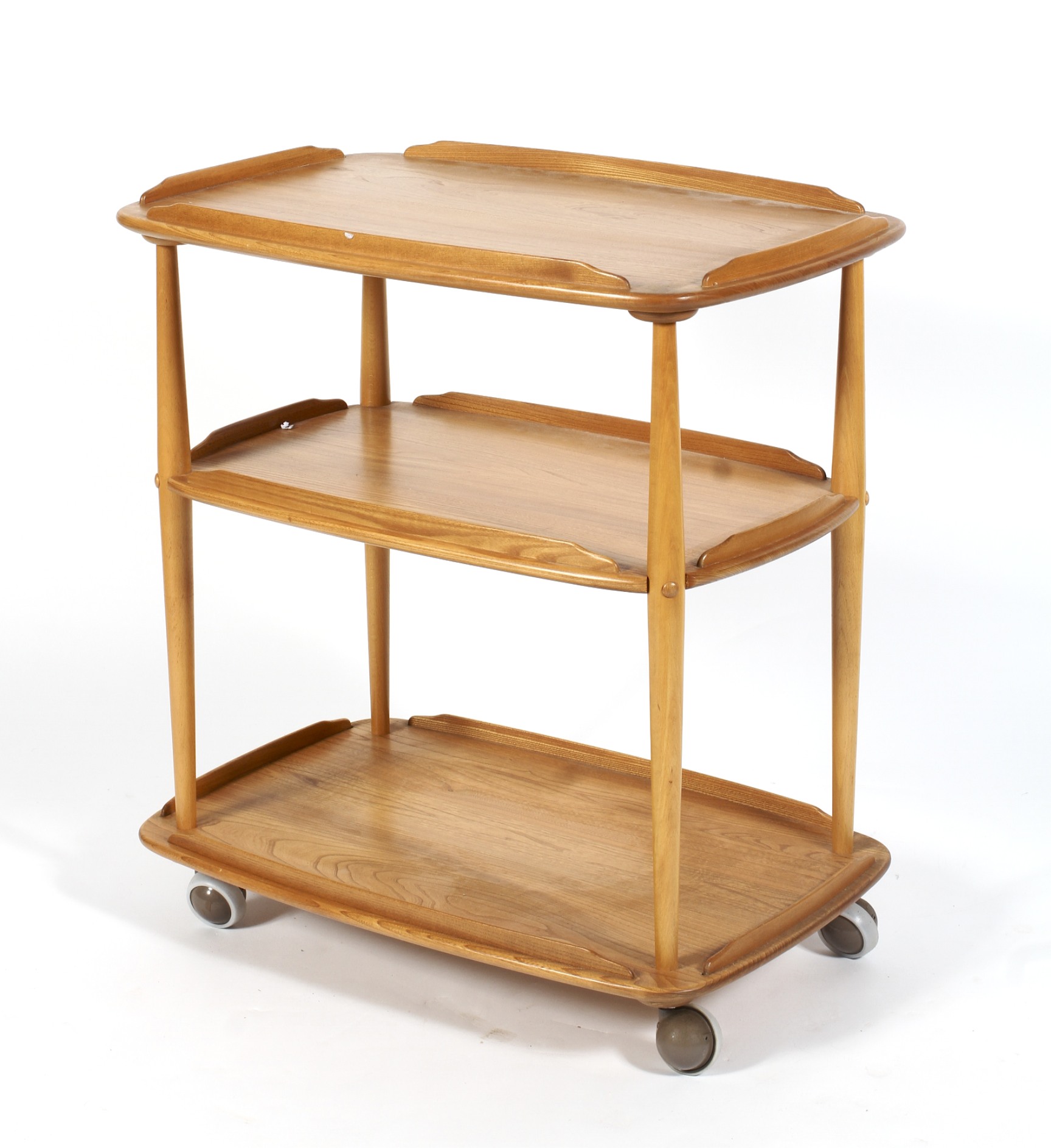 An Ercol push-pull blonde elm three tier tea trolley,