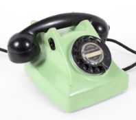 A retro GEC green telephone, with black dial and handset, fitted for electricity,