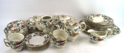 A Booths Flora Dora pattern part tea and dinner service, including: two lidded tureens, teapot,