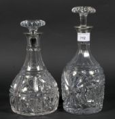 Two silver collared cut glass decanters, one being hallmarked London 1928 by Mappin & Webb,
