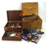 A group of tools in hinged wooden cases, including: saws, a Footprint drill, files,