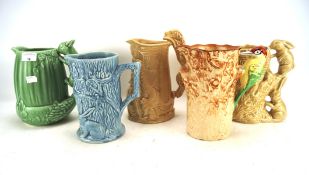 A group of five mid-century jugs, including Sylvac Wade and Weatherby,