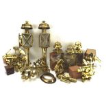 An assortment of metalware, including brass lanterns, microscope stands,