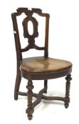 A 19th century mahogany chair, with cross stretchers, raised on turned supports,