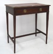 An early 20th century mahogany red leather topped side table/desk, the top with gilt tooled border,