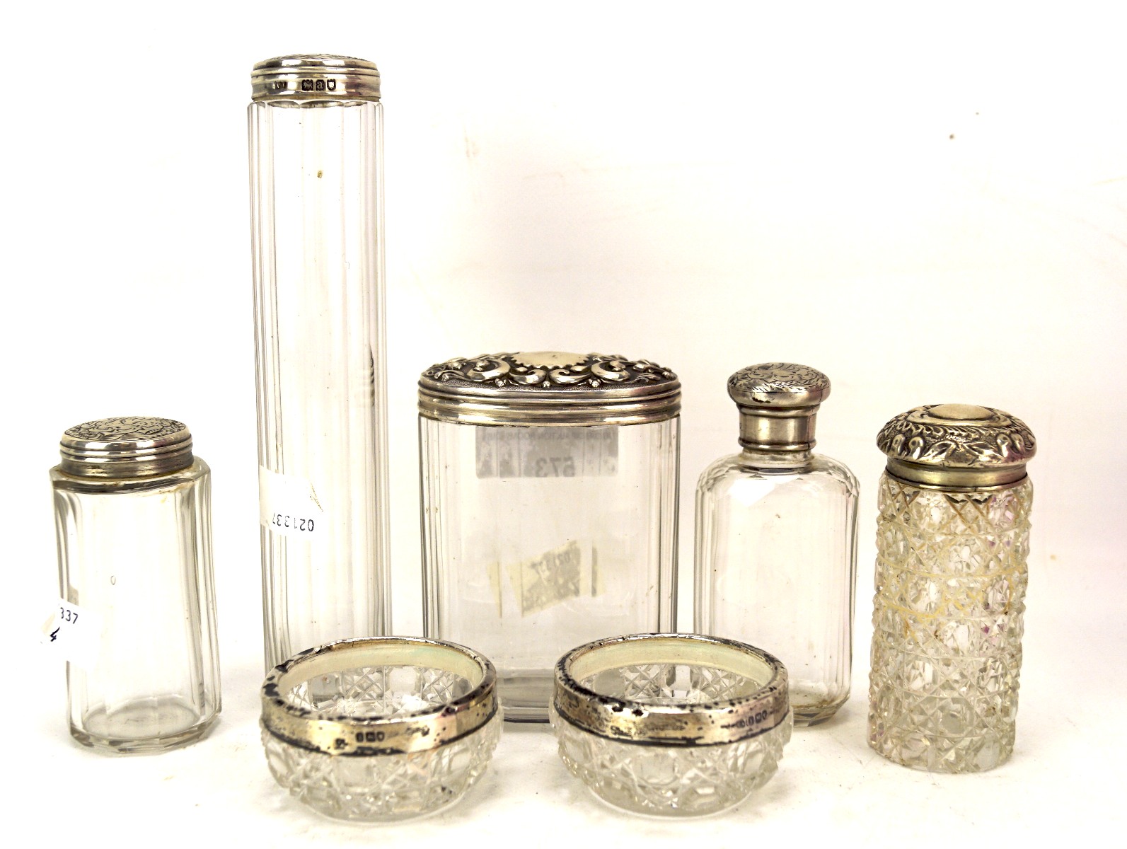 A collection of seven silver topped and mounted glass items,