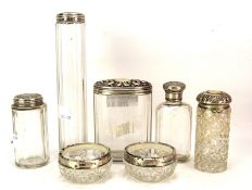 A collection of seven silver topped and mounted glass items,