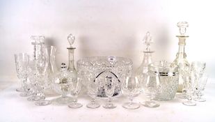 An assortment cut glassware, including decanters, bowl, champagne flutes,