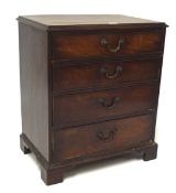 A small mahogany veneer chest of four graduating drawers,