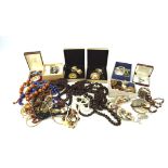 An assortment of costume jewellery, including earrings, necklaces, bracelets,