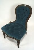 A Victorian button back upholstered nursing chair, with spoon-shaped back,