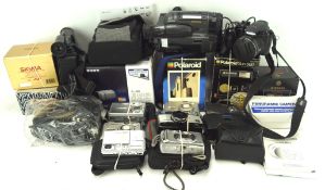 An assortment of vintage cameras, including examples by Polaroid supercolor 635,