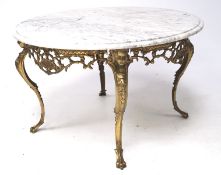 A contemporary marble topped table, of circular form,