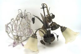 Two ceiling lights, one modelled as flowers with three branches topped with glass shades,