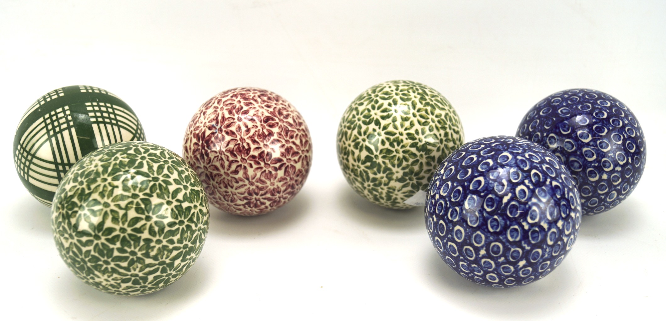 A collection of six Scottish ceramic carpet bowls, in three different colourways,