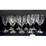 An assortment of liqueur drinking glasses, with enamelled and engraved decoration of flowers,