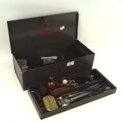 An assortment of watch maker's tools, including chains, clamps, straps,