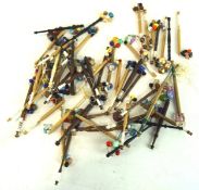 A collection of vintage lace making bobbins, mostly wooden examples and one bone,