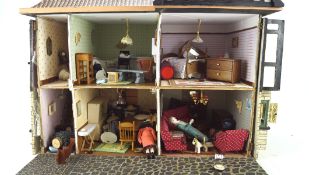 A vintage doll's house, in the Tudor style, with some contemporary and later fittings and contents,