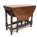 An early 20th century oak drop leaf gate leg table, raised upon turned supports,
