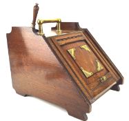 A 20th century magogany coal scuttle, with brass handles and a shovel,