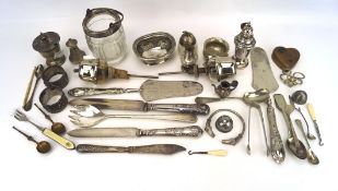 An assortment of silver plate, including flatware, dishes, shakers,