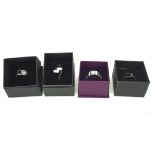 Four contemporary silver dress rings, set with assorted stones,