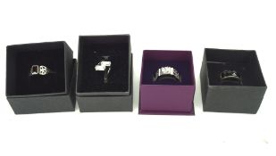 Four contemporary silver dress rings, set with assorted stones,