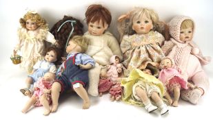 A collection of dolls, various sizes and designs,