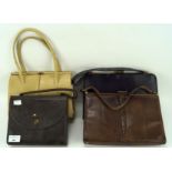 Three ladies vintage handbags and a travelling vanity set, of assorted sizes and designs,