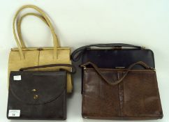 Three ladies vintage handbags and a travelling vanity set, of assorted sizes and designs,