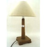 An early 20th century oak table lamp,