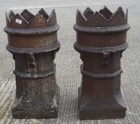Two large stoneware chimney pots with zig-zag openein,