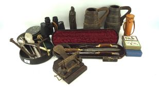 An assortment of collectables, including two wooden barrel tankards, spirit level,