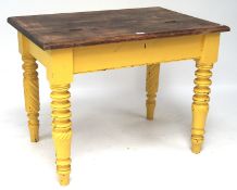 A vintage yellow-painted dining table/desk,