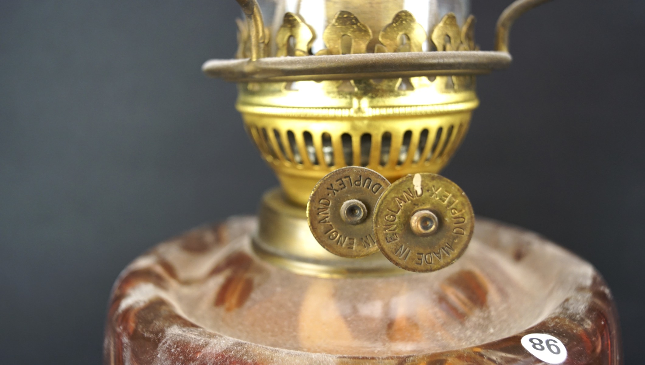 Two early 20th century oil lamps, both with cast metal bases, - Image 2 of 2