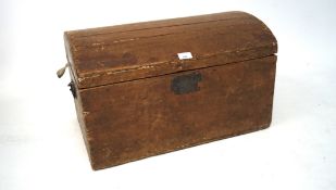 A early 20th century dome topped trunk, with handles to either side,