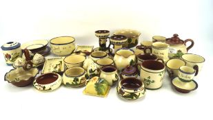 A collection of Torquay ceramics, to include teacups, pots, egg cups, cups,