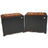A pair of upholstered stools, the wooden frames painted purple with handles to either side,