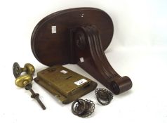 A Victorian mahogany wall bracket and a door lock, the bracket with carved scrolling motif,