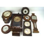 An assortment of 20th century wall clocks and barometers,